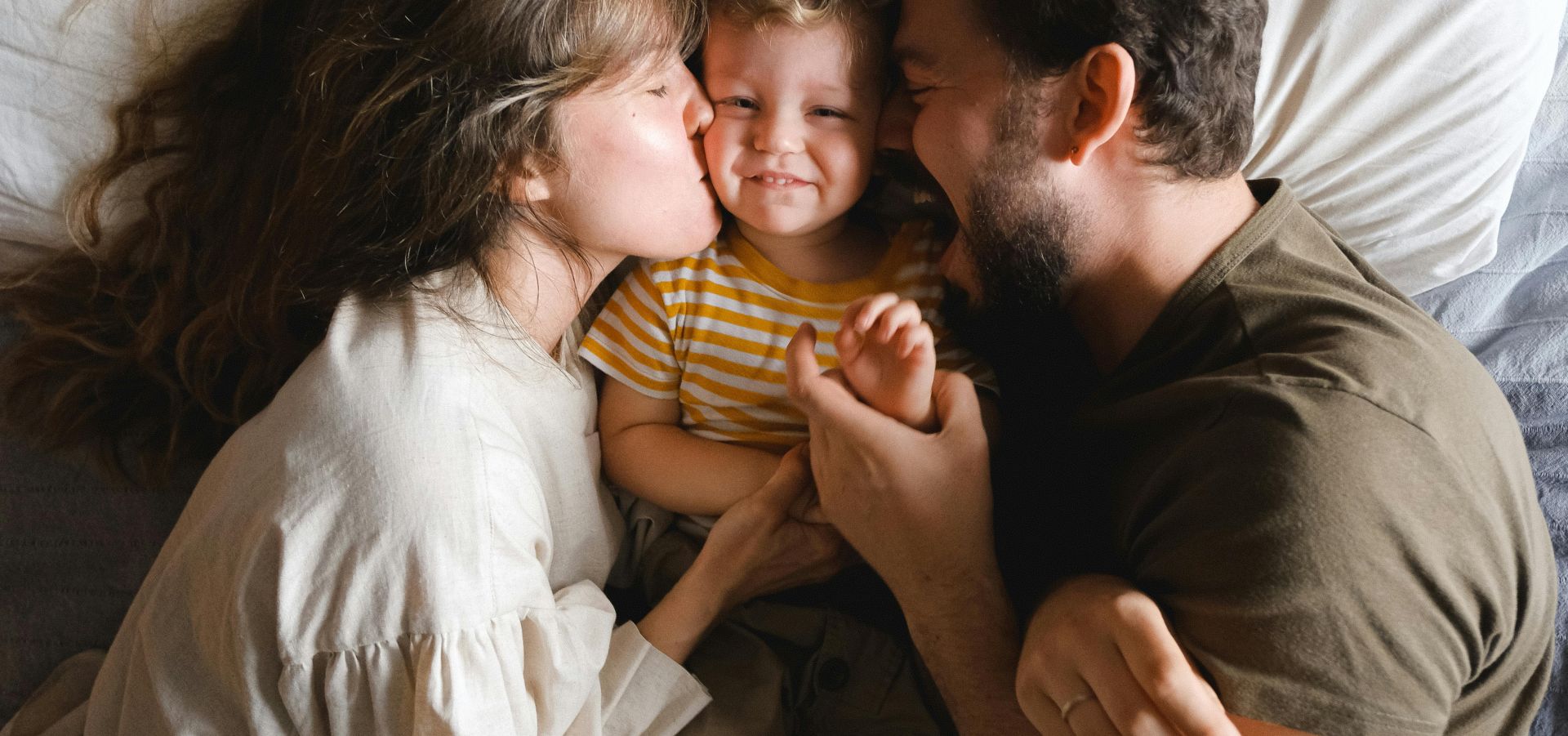 Family Lying on Bed